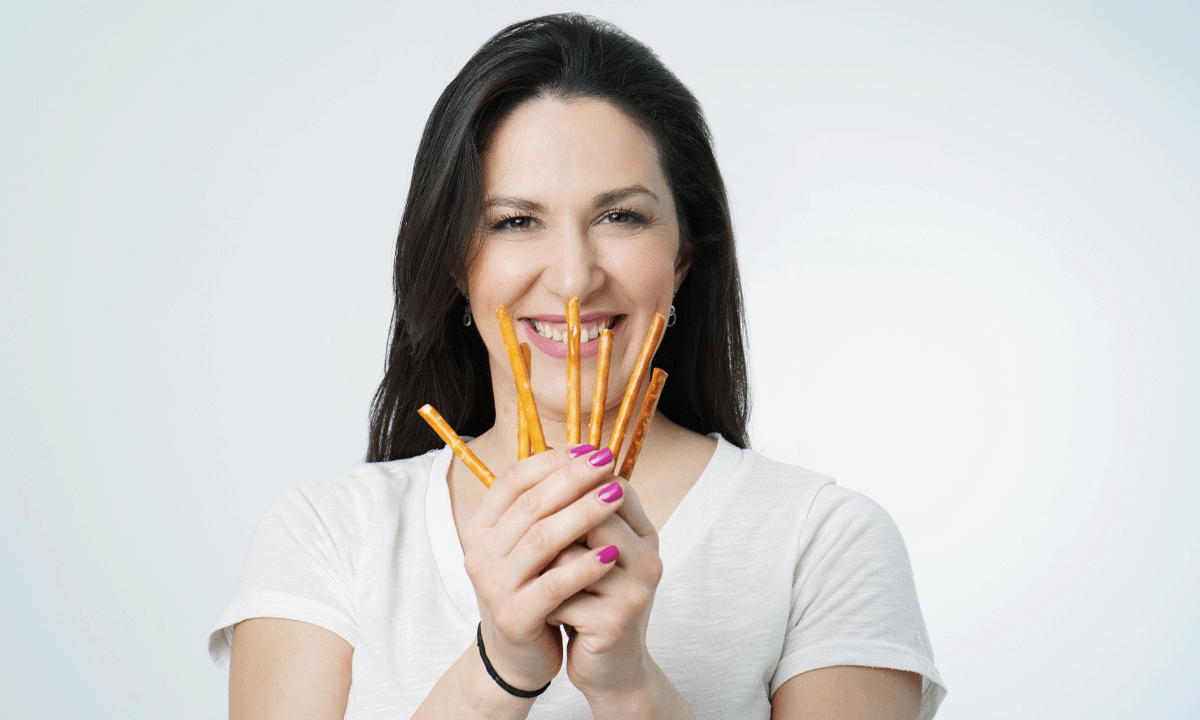 Woman holding pretzel sticks